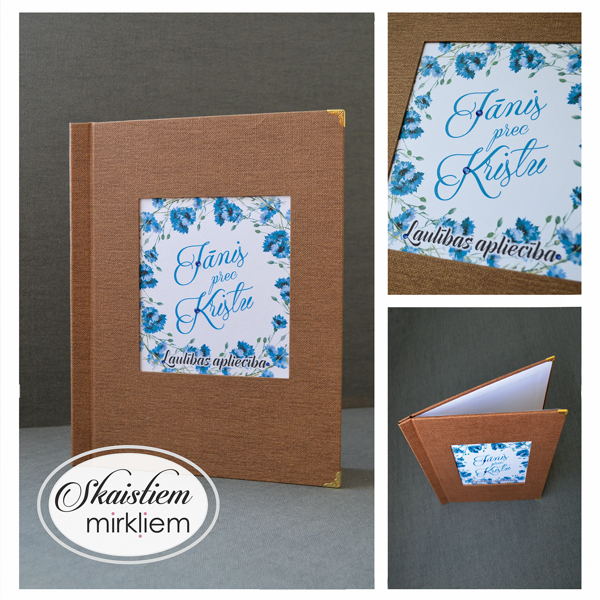 Rustic stila laulības apliecības vāķi ar rudzupuķēm un vārdiem "Jānis prec Kristu"