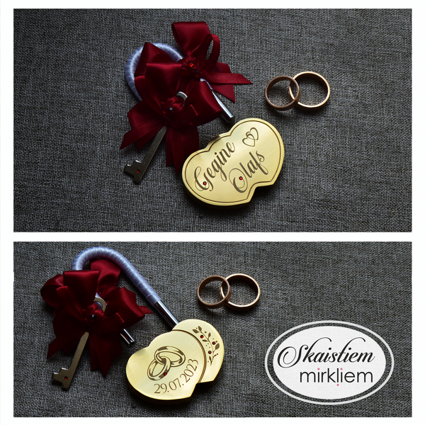 Gravēta sirds formas slēdzene "Gegina un Olafs" ar mazu sirsniņu simbolu starp vārdiem