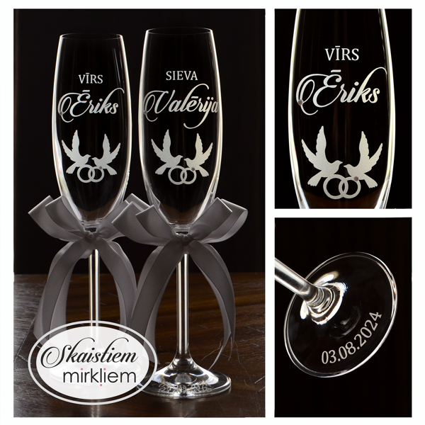 Kāzu glāzes ar gravējumu "Vīrs", "Sieva", vārdiem, dūju simbolu un gredzeniem