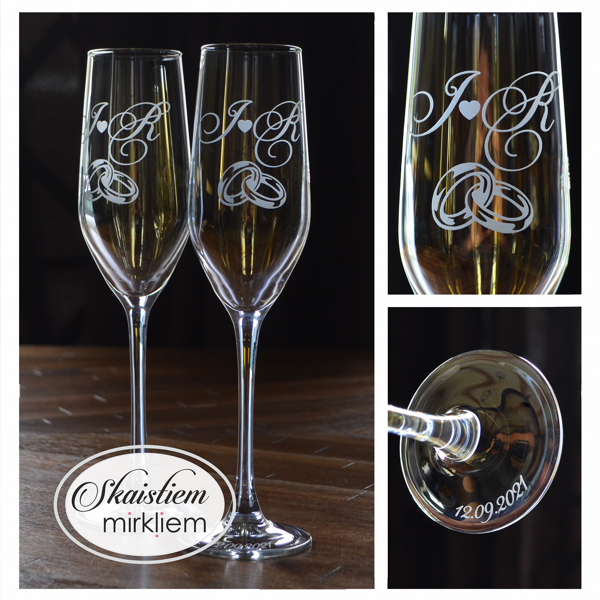 Elegants gravējums ar iniciāļiem J un R un savītu gredzenu motīvu, datumu