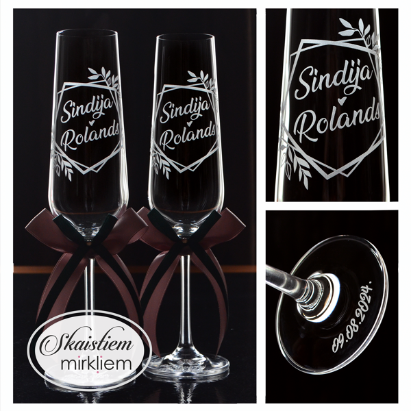 Elegants gravējums Sindijai un Rolandam rombveida lapu rāmī ar lentēm