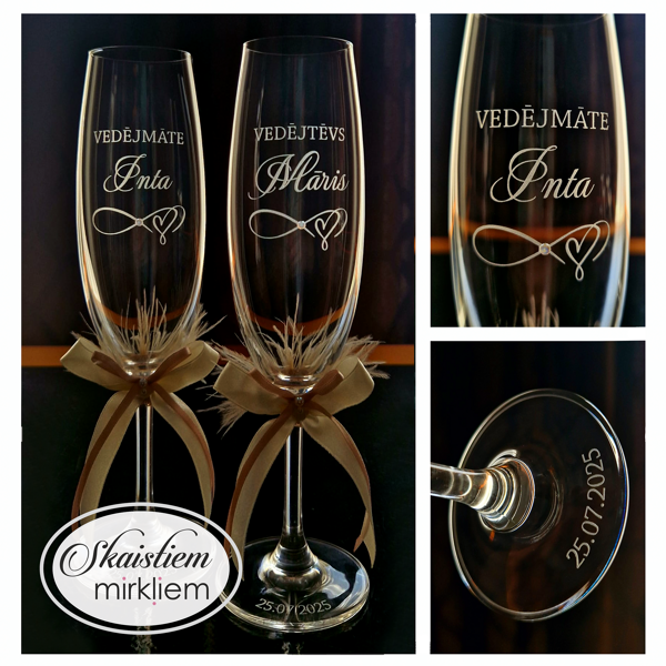 Vedēju glāzes Intai un Mārim ar bezgalības simbolu un zelta lentēm/spalviņām