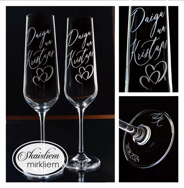 Gravētas kāzu glāzes Daigai un Kristapam ar sirds simbolu, iniciāļiem un datumu